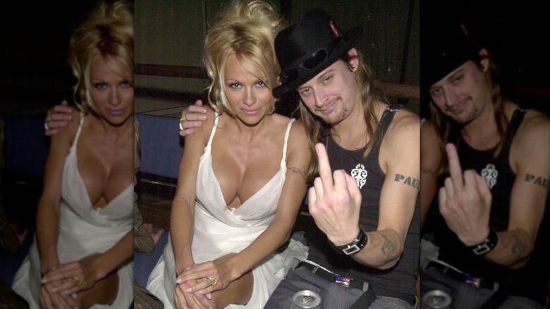 Pamela Anderson posing with Kid Rock while he flips off the camera