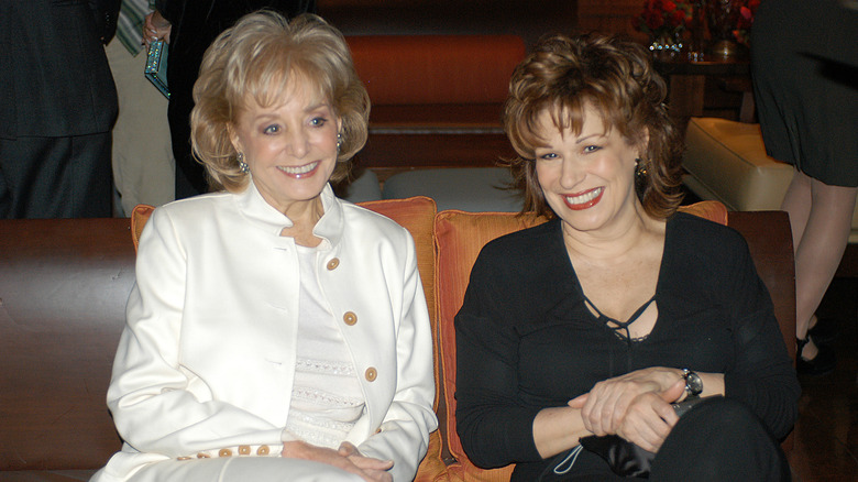 Barbara Walters and Joy Behar smiling and sitting together