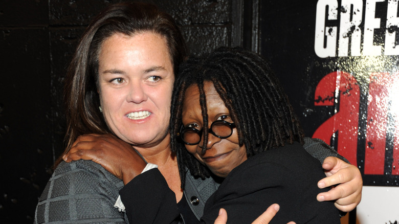 Whoopi Goldberg with her arms around Rosie O'Donnell