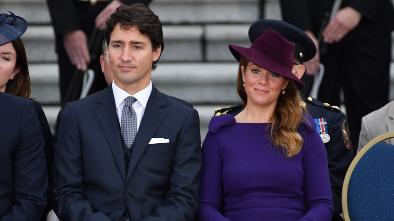 Justin Trudeau and Sophie Trudeau sitting at an event