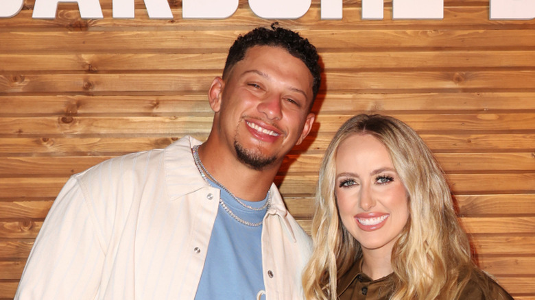 Patrick and Brittany Mahomes wood panel background
