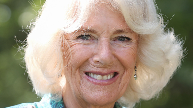 Camilla, Duchess of Cornwall, smiles at an event.