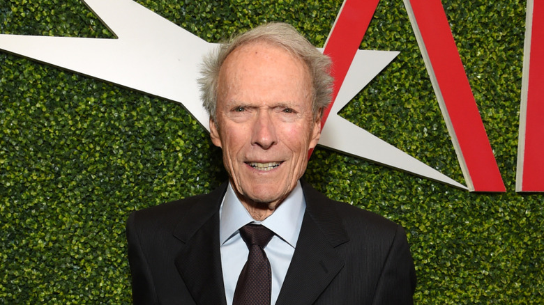 Clint Eastwood smiling at a red carpet event