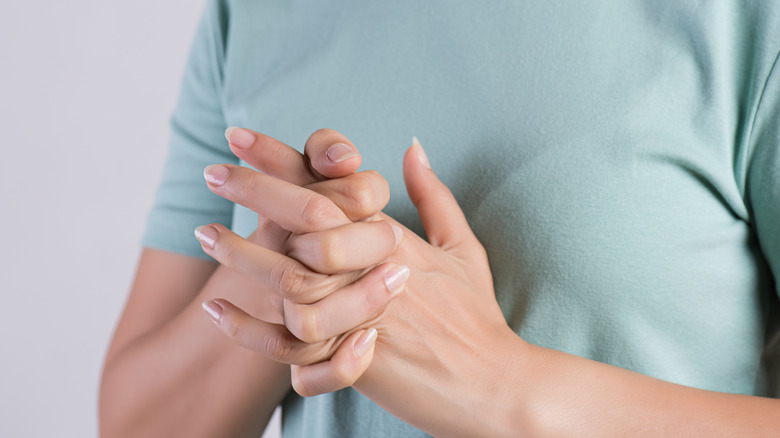 woman cracking her knuckles