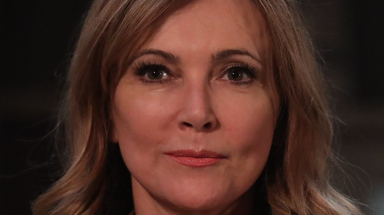 Emma Samms smirking