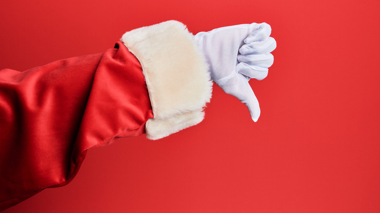 Santa Claus' hand giving a thumbs down