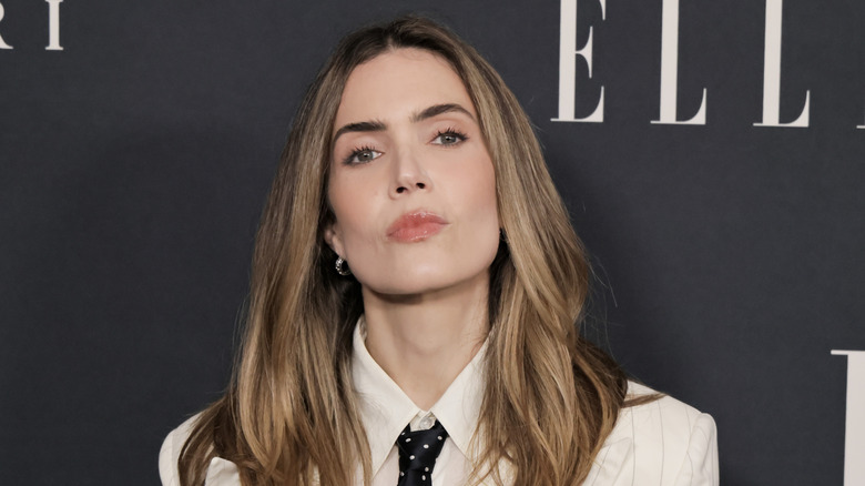 Mandy Moore in front of an ELLE magazine background