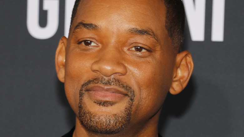Will Smith looking serious at an event