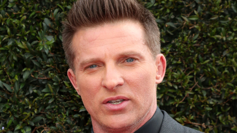 Steve Burton in front of a hedge