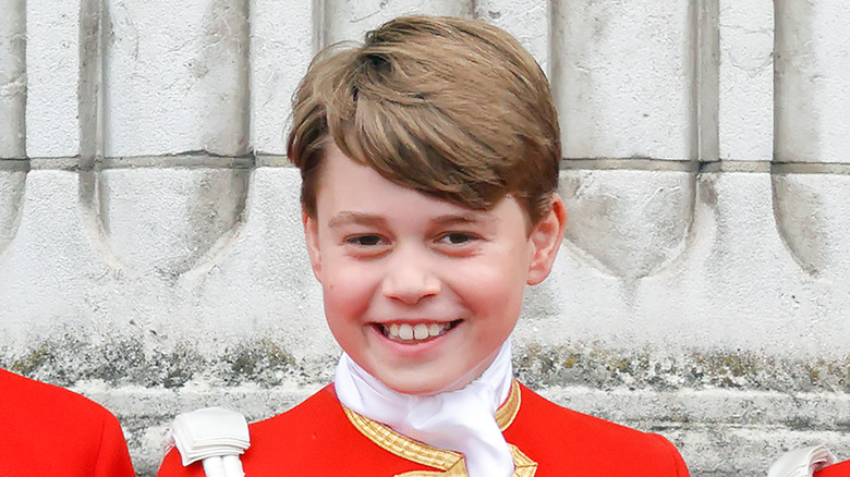 Prince George smiling at Charles's coronation