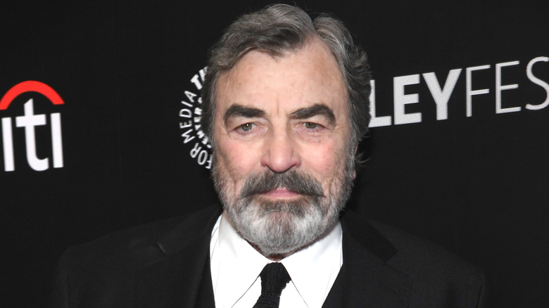 Tom Selleck posing at PaleyFest.