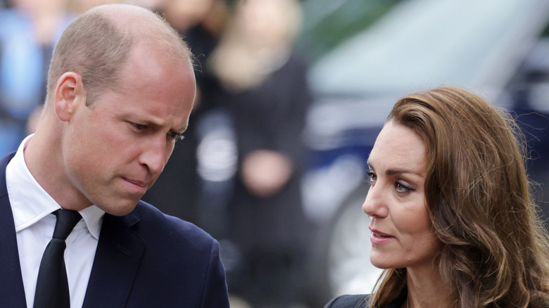 The Prince and Princess of Wales looking at tributes to Queen Elizabeth II