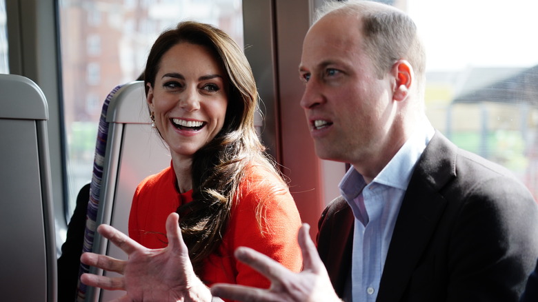 Kate Middleton smiling at Prince William talking