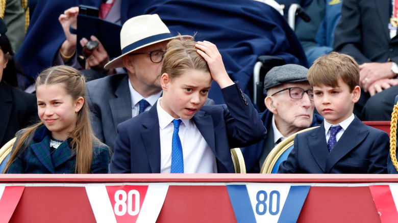 Prince George, Princess Charlotte, and Prince Louis sit together for VE Day