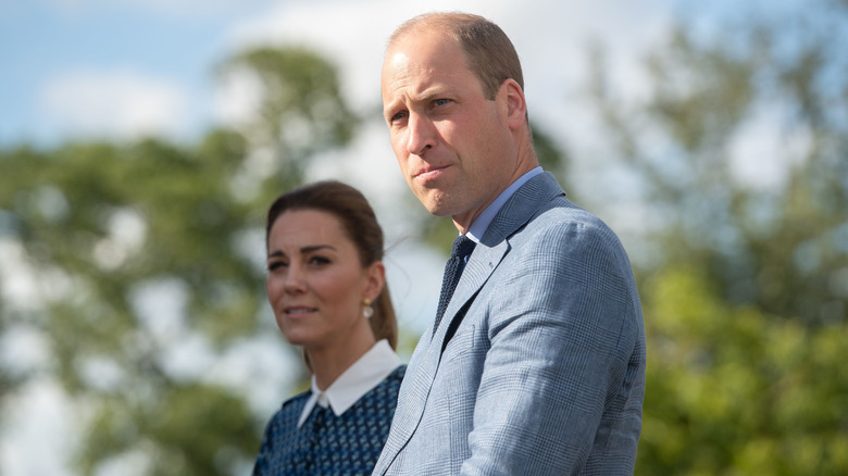 Prince William and Kate Middleton standing next to each other