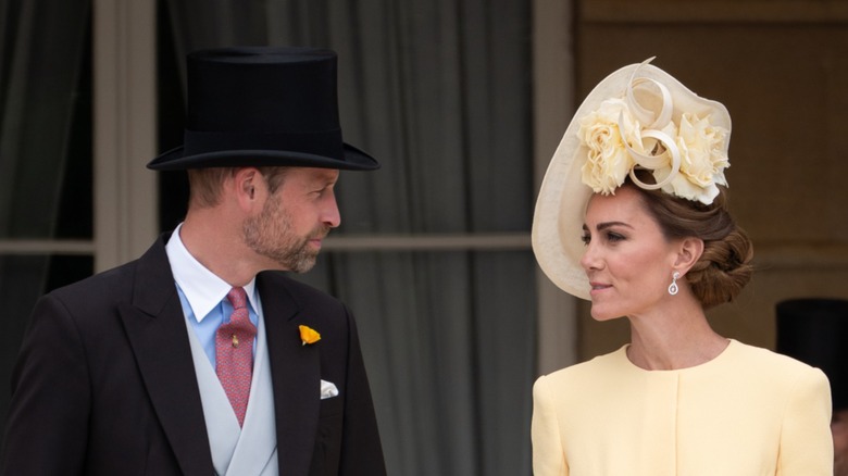 Prince William and Kate Middleton talking to each other at their May 2025 Garden Party