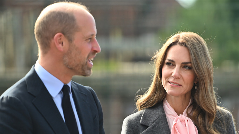 William, Prince of Wales and Catherine, Princess of Wales speaking to each other