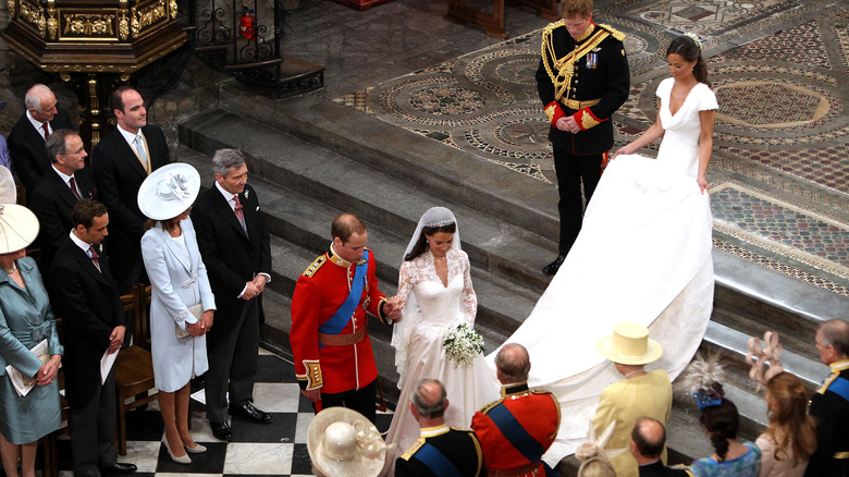 William, Prince of Wales and Catherine, Princess of Wales acknowledging Queen Elizabeth at their wedding