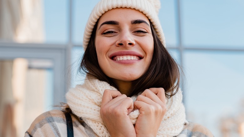 Woman wearing coat and scarf