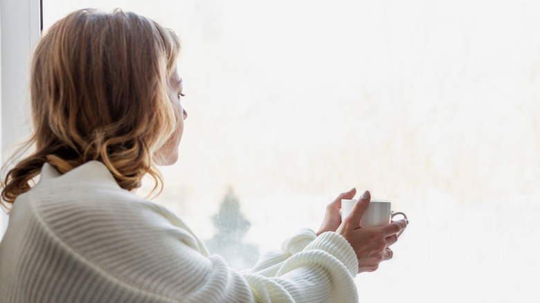 woman in white sweater