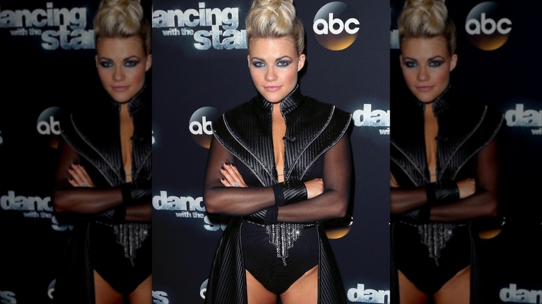 Witney Carson with her arms crossed