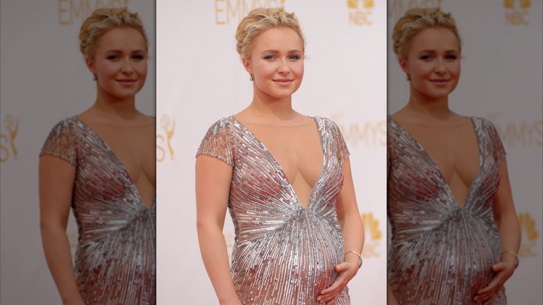 Hayden Panettiere cradling baby bump at red carpet event