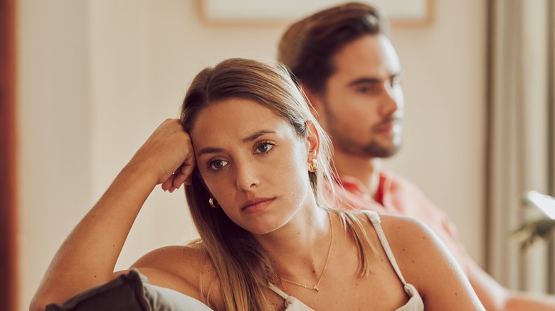 Woman staring blankly into distance