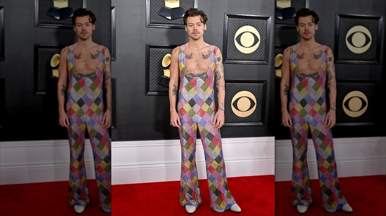 Harry Styles posing on the red carpet at the 2023 Grammys