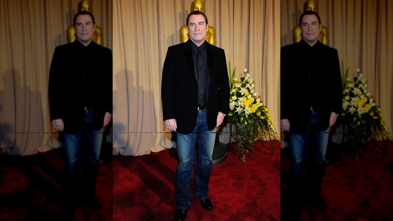 John Travolta walking the red carpet at the 2010 Oscars