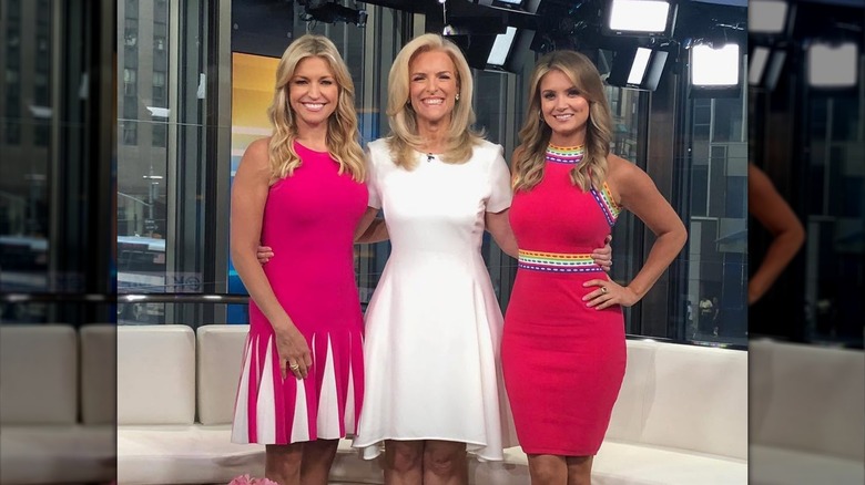 Fox News anchors all dressed in white or pink in the studio