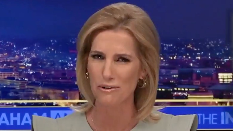 Laura Ingraham presenting her Fox News show while wearing a top with pointed shoulders