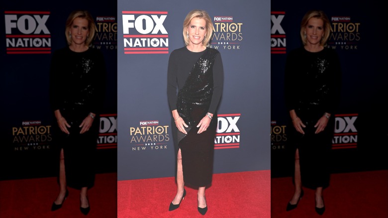 Fox News anchor Laura Ingraham stood infront of a photography background on the Fox Nation Patriot Awards, wearing a black sequinned dress