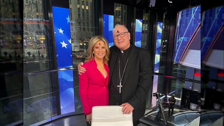 Fox News anchor Martha MacCallum on the left with Cardinal Dolan on the right, stood next to each other in the Fox News studio