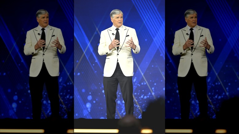 Fox News presenter Sean Hannity at the Fox Nation Patriot Awards wearing a white suit jacket with a black tie and black pants