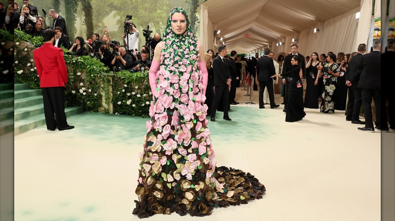 Jordan Roth posing in flower gown