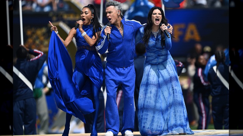 Nicole Scherzinger, Robbie Williams, and Laura Pausini singing at 2026 World Cup