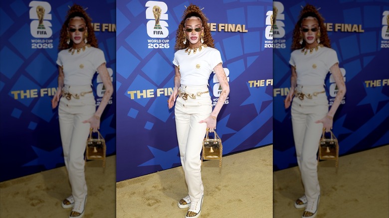 Winnie Harlow in white and gold shirt and pants for World Cup final