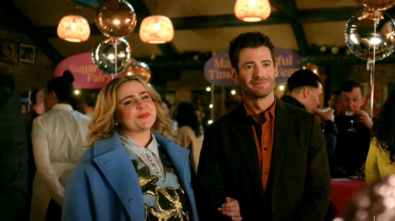 Screenshot of Mae Whitman in Twelve Dates 'Til Christmas wearing a blue coat