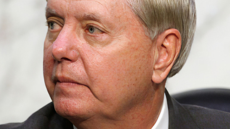 Senator Lindsey Graham looking to the side with serious expression