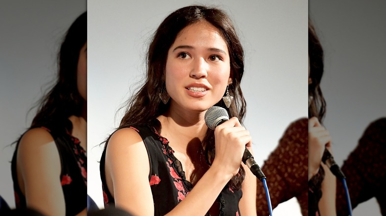 Kelsey Asbille speaking with microphone at Wind River panel in 2017
