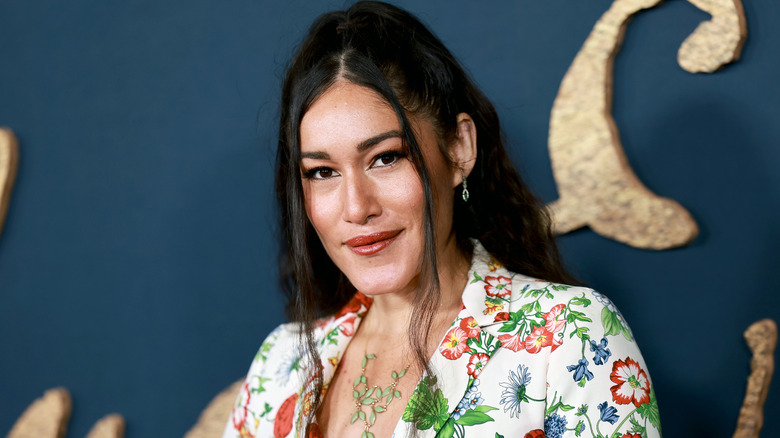 Q'orianka Kilcher at The Pale Blue Eyes premiere wearing a floral shirt