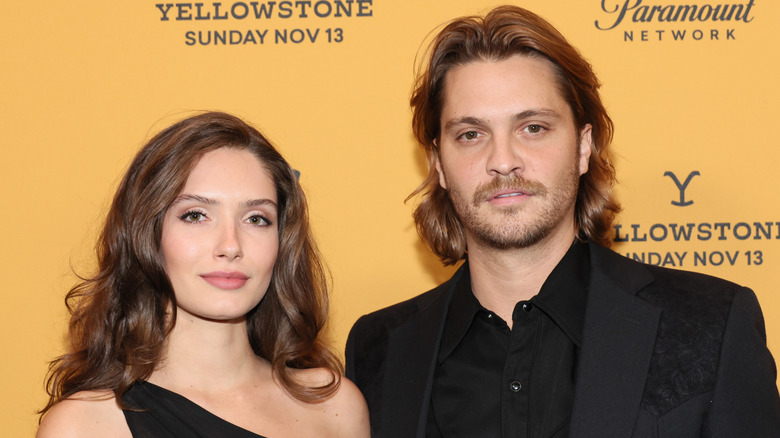 Bianca Rodrigues and Luke Grimes posing alongside each other at the Yellowstone season 5 premiere