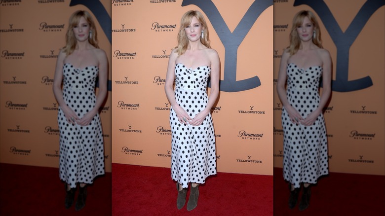 Kelly Reilly smiling in polka-dot dress at TV event