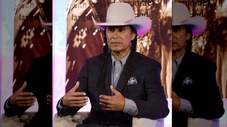 Mo Brings Plenty speaks at a panel in 2025