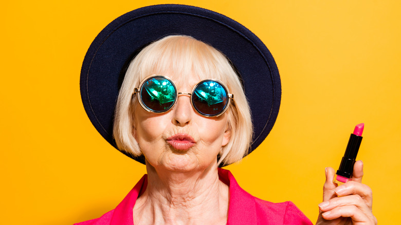 An older woman puckering her lips