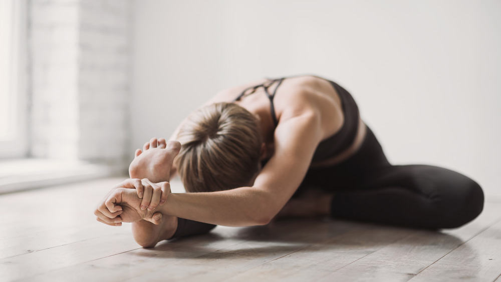 Woman stretching her leg