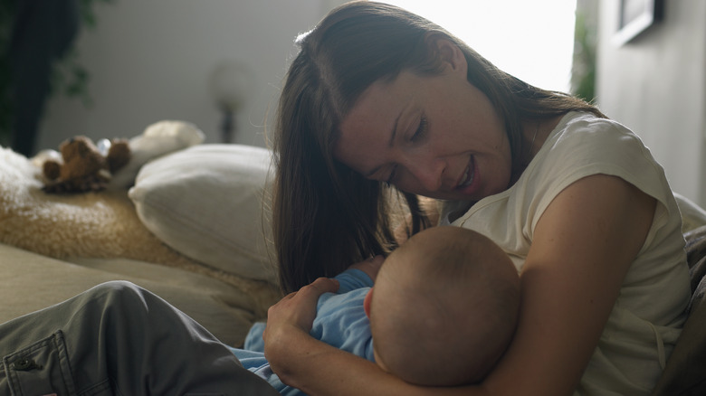 A woman breastfeeding her child