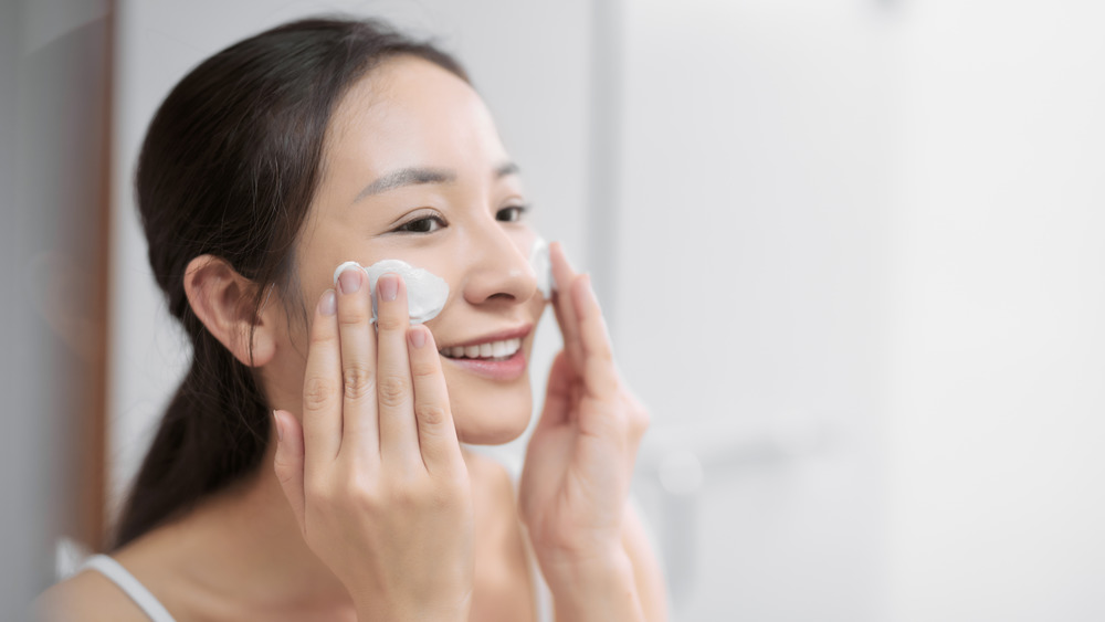 Woman washing her face