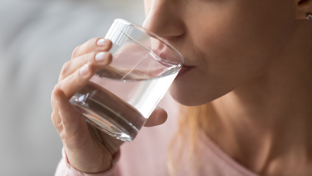 Woman drinking a glass of water 