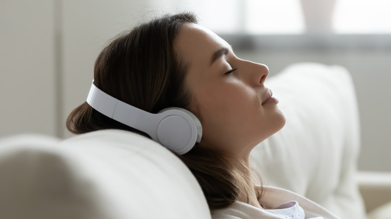 Woman wearing white headphones